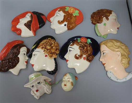 A group of nine ceramic wall masks